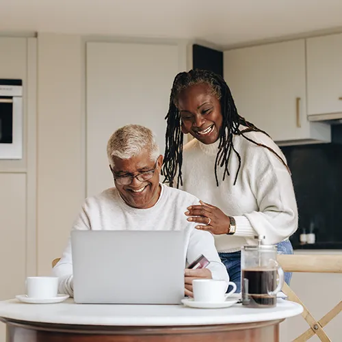 526129588 Happy senior couple using computer at home